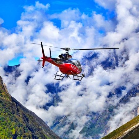 Flying red helicopter in Everest Base Camp area